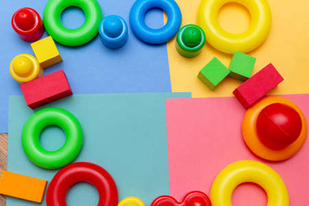 Colorful child kidâ€™s education toys pattern background copy space on the bright background....