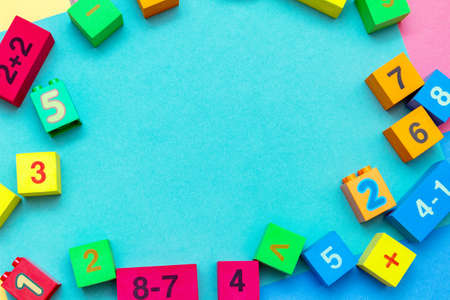child kid colorful education toys cubes with numbers math pattern background on the bright background. Flat lay. Childhood infancy children babies concept.の写真素材