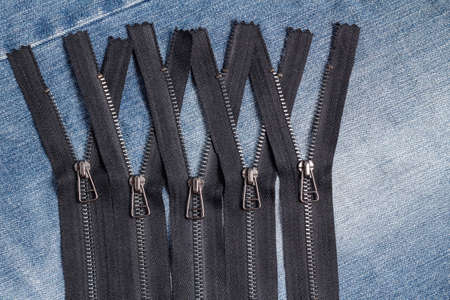 Pack a lot of black metal brass zippers stripes with sliders pattern for handmade sewing tailoring...