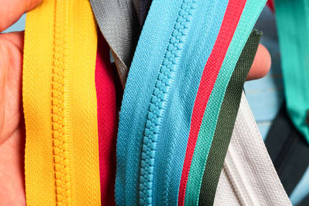Pack lot of colorful plastic and metal zippers stripes with sliders pattern for handmade sewing...