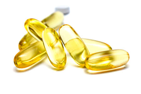 Vitamin e omega 3 fish oil yellow pills vitamins sport nutrition healthy on the white background...