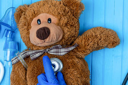 toy bear with inhalation medical mask close upの写真素材