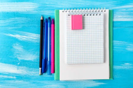 Back to school concept with stationery office supplies pens, pencils, brushes, felt pens, markers,...