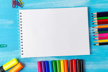 Back to school concept with stationery office supplies pens, pencils, brushes, felt pens, markers, paper clipsの写真素材