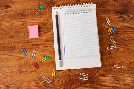 composition with notebook blank page colorful pencil, marker and pen mock-up Back to school concept