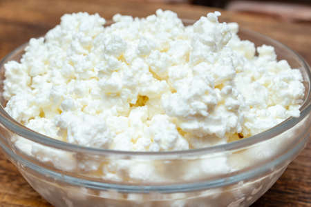 farm cottage cheese close up on wooden background protein healthy diet eco product