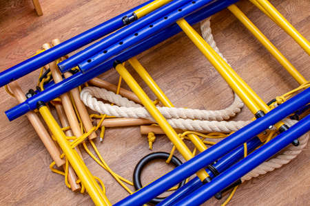 Disassembled home gymnastic wall bars on the floor. Sport gym home concept