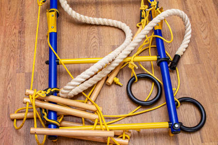 Disassembled home gymnastic wall bars on the floor. Sport gym home concept