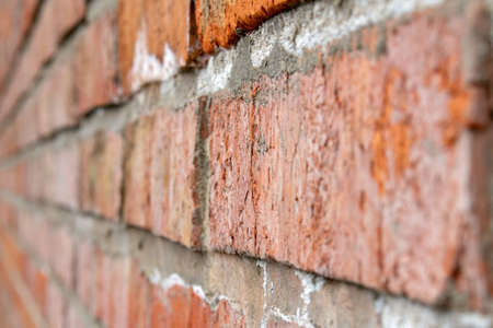 red brick wall texture close up selective focusの写真素材