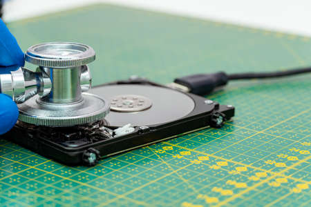 hard drive diagnostics with a stethoscope. Recovery, search lost data, information in hdd repair serviceの写真素材