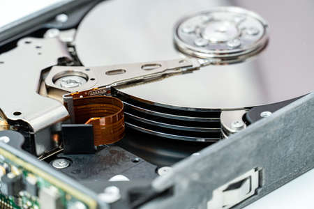 Open hard disk drive close up. Information, cloud data storage, infrastructure cost concept