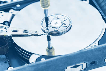 hard disk drive disassembling process with screwdriver in information recovery, repair HDD service