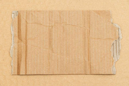 Old torn cardboard paper texture background close up with copy spaceの写真素材
