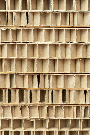 cut of honeycomb cardboard pack stack with large cells close-up as a backgroundの写真素材
