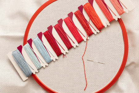 frame with set, cotton fabric and thread for cross stitch embroidery close-up