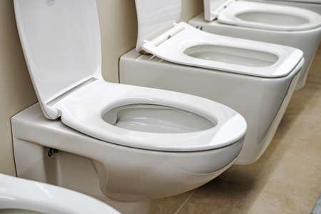 Lot of white toilets in hardware store, plumbing department