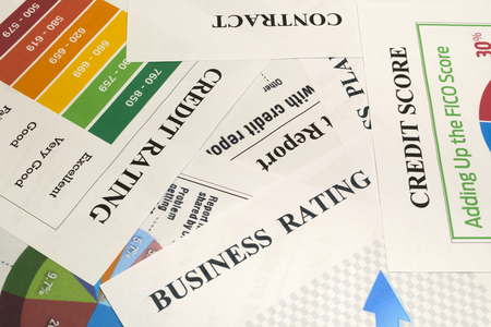 Credit score, report, rating and contract - documents on the table.の写真素材