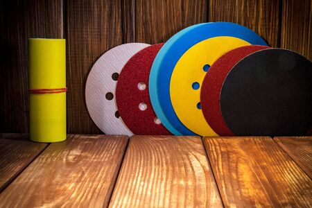 Big set of abrasive tools for grinding on the background of old wood. Different color.の写真素材