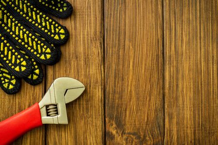 Necessary set of tools for plumbers on a vintage wooden background.の写真素材