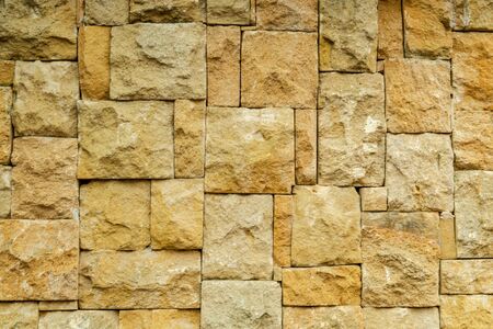 Texture of paving stones. Facing material under imitation of a paving stone wall for construction. Example at the exhibition.の写真素材