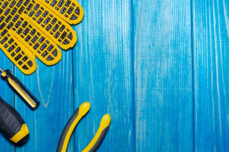 Construction tool on blue wood board maintenance concept. Free space for advertising.の写真素材