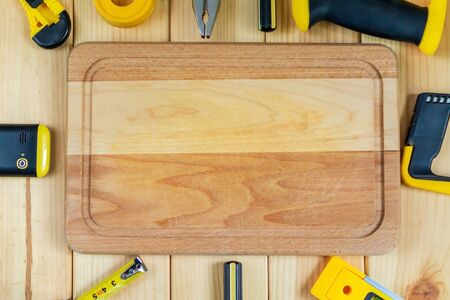 Saw and gloves for the Builder on a natural wooden  with free space for advertising.の写真素材