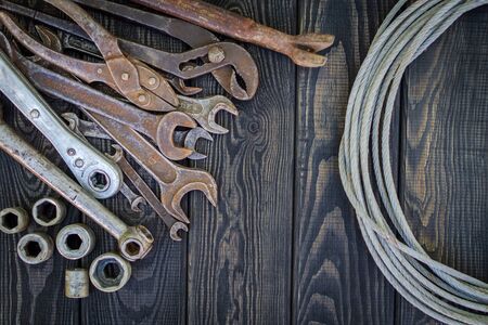 Rusty Old Tools on black vintage woodの写真素材