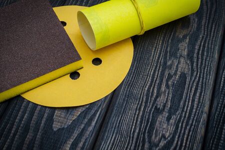 Set of abrasive tools and sandpaper on dark vintage woodの写真素材