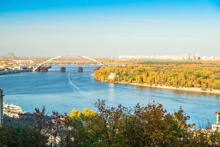 Beautiful view of the Dnieper river with ships in Kiev at sunsetの写真素材