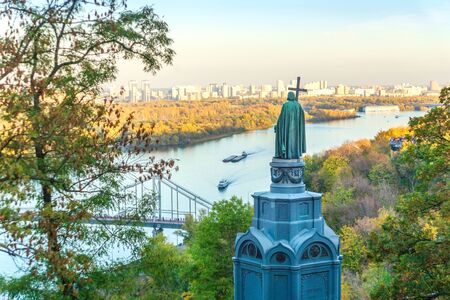 Beautiful view of the Dnieper river with ships in Kiev and an ancient monumentの写真素材