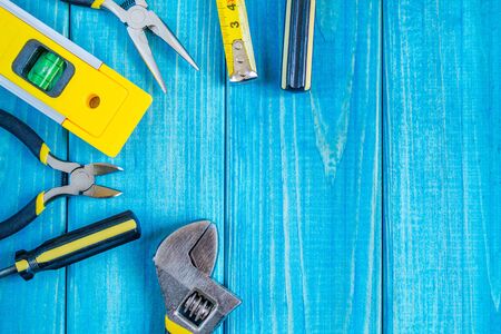 Tools for master builder and accessories set on blue wooden vintage background for the master Builderの写真素材