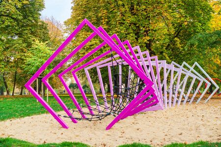 Children's amusement ropeway in purple metal frame for safety in the Park
