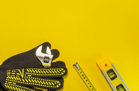 Tools for master builder and accessories set on yellow backgroundの写真素材