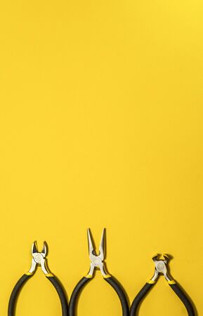 Tools for master builder and accessories set on yellow backgroundの写真素材