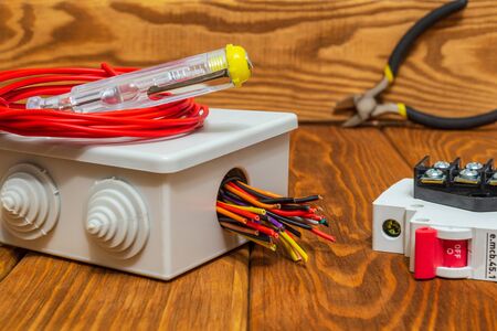 Electrical junction boxs with cables wire and tool usually used in the electric installation processの写真素材