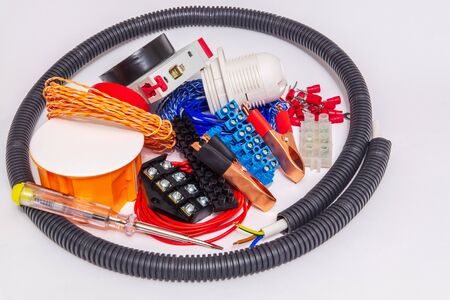 Kit spare parts and tools for electrical prepared before repair on gray background