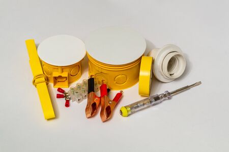 Kit spare parts and tools for electrical prepared before repair on gray background
