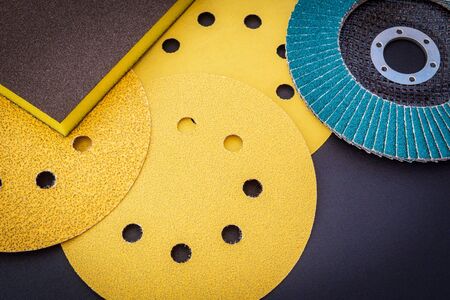 Set of yellow abrasive tools on black background. The wizard is used for grinding itemsの写真素材