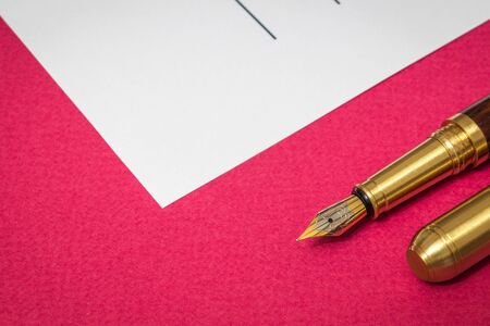 Office still life red table with pen and blank entry form prepare for notes