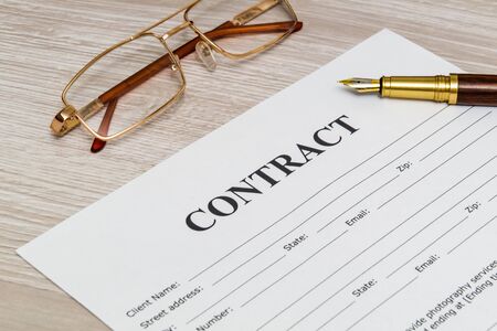 Contract form on the office desk with glasses and pen, business idea