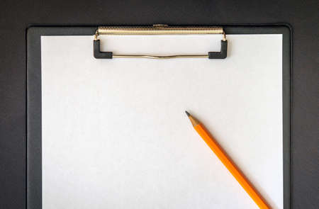 Paper sheet with empty to do list and and pencil for writingの写真素材