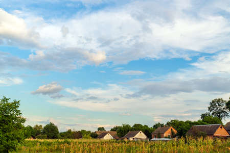 A village with tare houses in the center of Europe against a blue sky