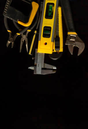 Tools for master builder on a isolated black backgroundの写真素材