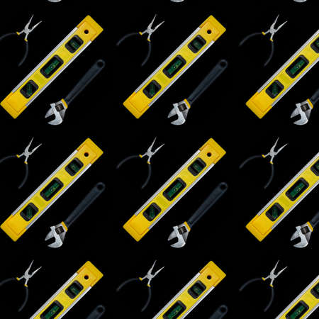 Building level and tools seamless pattern isolated on black background. Collection of industrial seamless patternsの写真素材