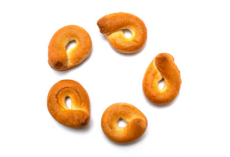 Homemade bagels on white isolated background. Traditional dish goes well with tea or coffeeの写真素材
