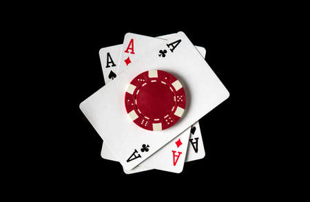 Poker game with three of a kind or set combination. Chips and cards on the black table in poker club