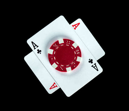 Poker game with one pair combination. Chips and cards on the black table in poker club. Free...