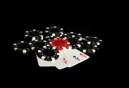 Chips and three aces on the black table in the casino or poker club. Fortune or success in the game.