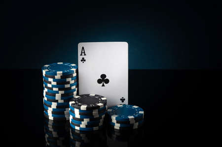 Successful win with ace playing card in poker game. Chips and card on the table.