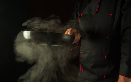 Molecular gastronomy or cuisine. The chef cooking food in a frying pan. Menu for restaurant or hotel with advertising spaceの写真素材